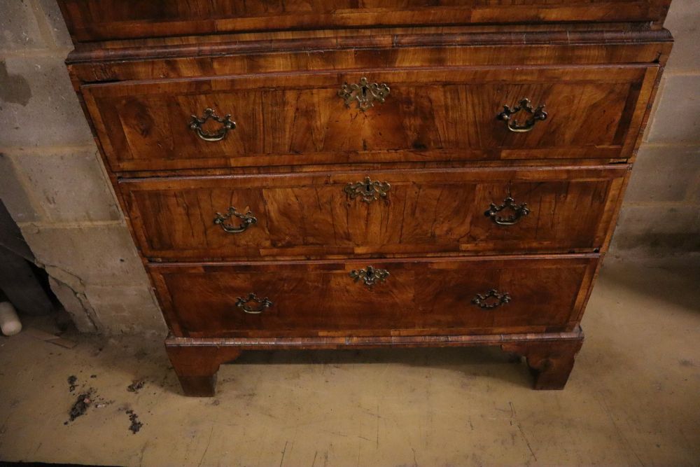 An early 18th century banded walnut tallboy, with oak sides, width 108cm depth 55cm height 180cm